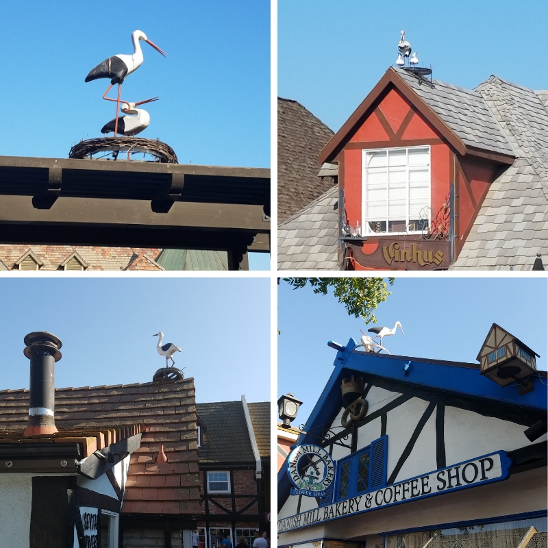 Various stork statues on the rooftops in Solvang California