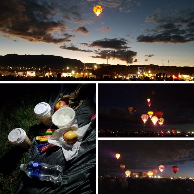 Breakfast picnic of coffee, yogurt and fruit; glowing hot air balloons light up the dark night sky